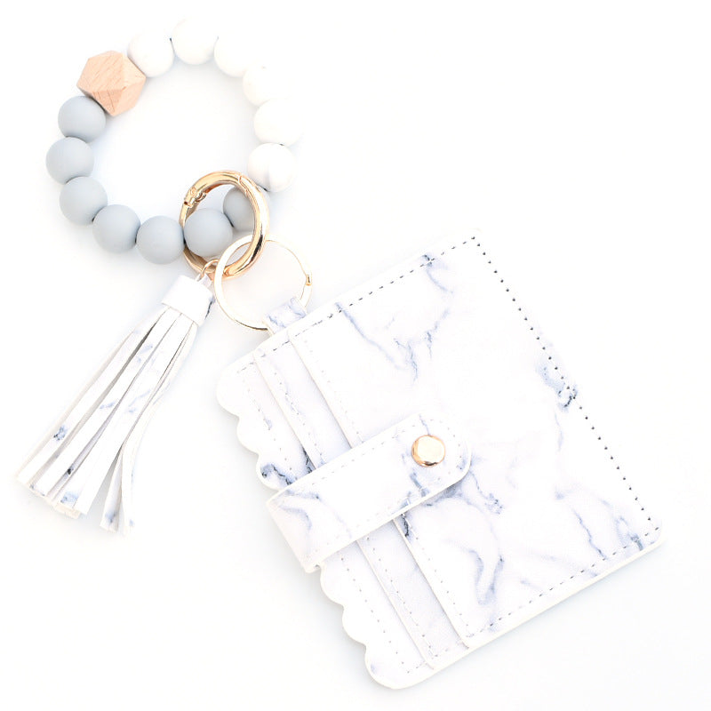 Llavero colorido al por mayor de la muñeca del monedero de la borla de la PU de los granos del silicón